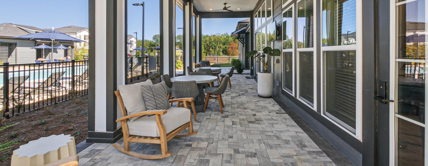 long covered patio with tables and chairs