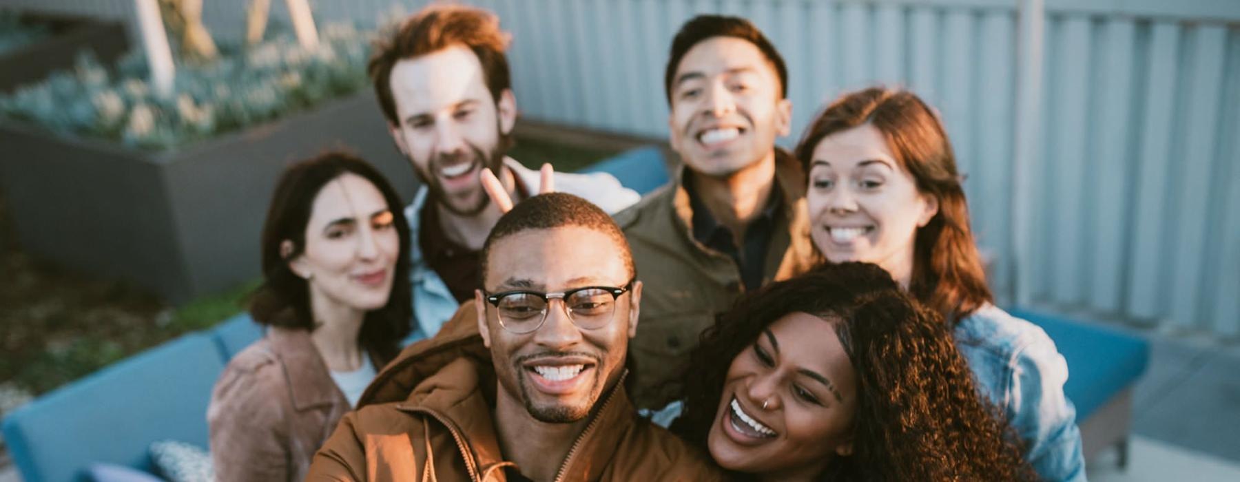 friends take a group selfie outdoors