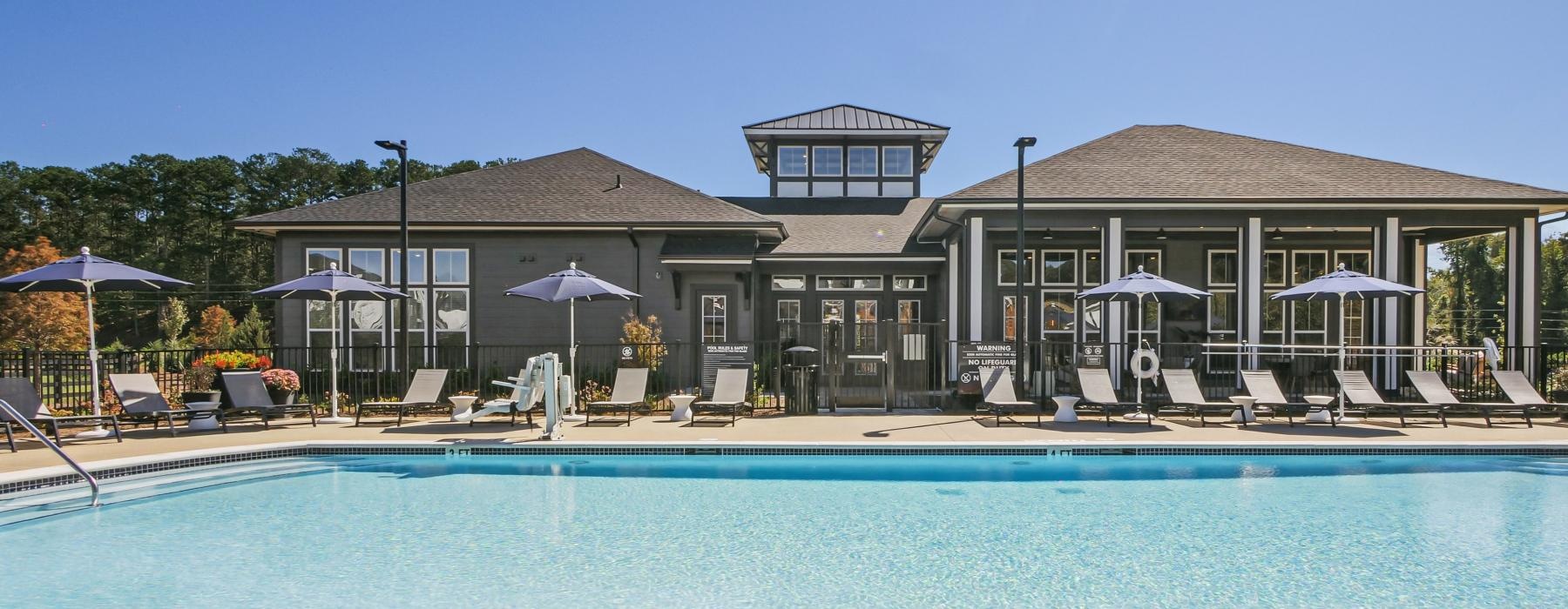 pool surrounded by lounge chairs