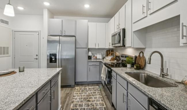 a kitchen with white cabinets