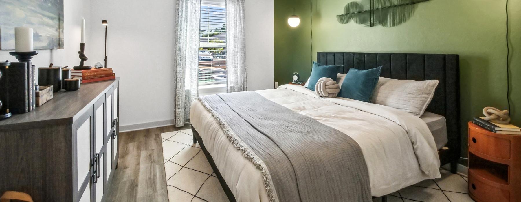 a bedroom with a bed and a window