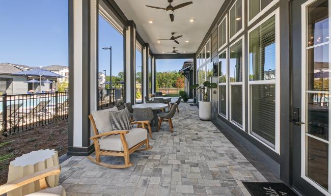 long covered patio with tables and chairs